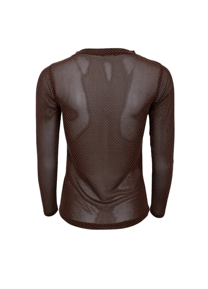 En sort netbluse med hvide prikker fra Black Colour – Jessie Kaffe, vist bagfra på en ensfarvet baggrund.