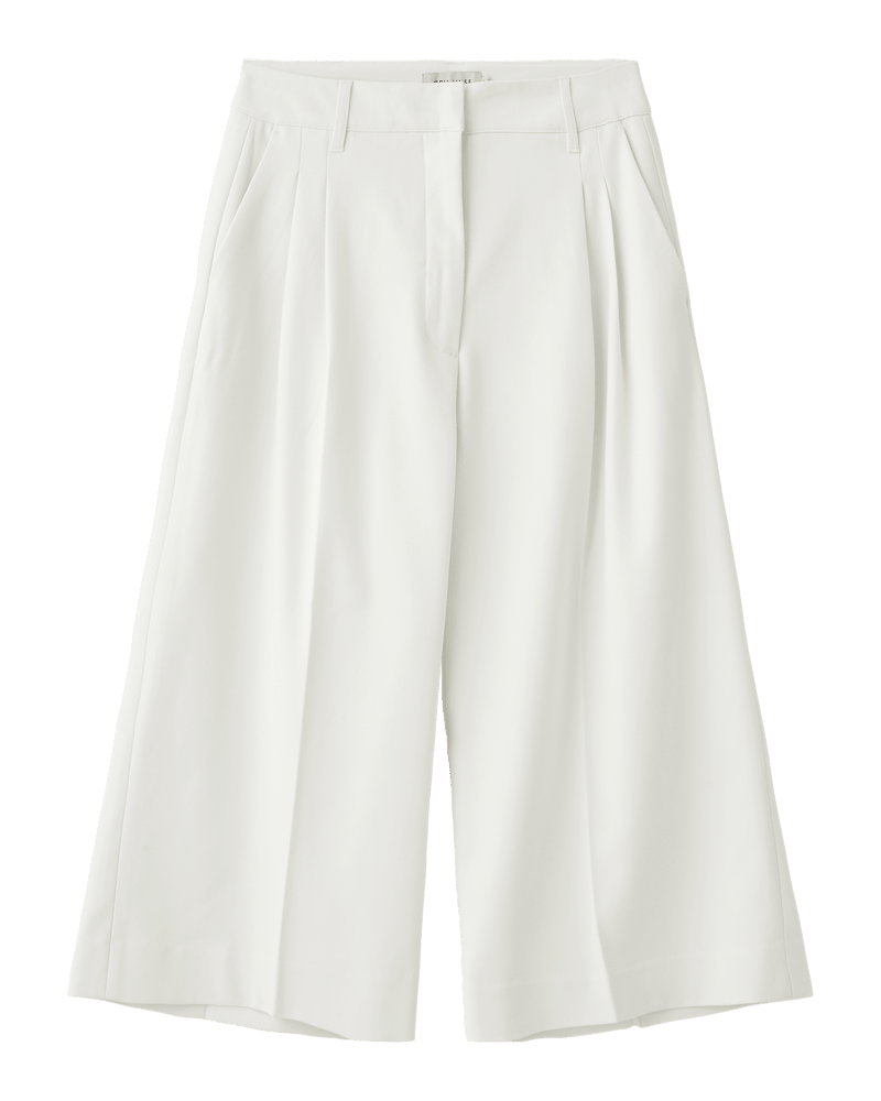 Copenhagen Muse Tailor: Offwhite bukser med brede ben og høj talje, med læg og sidelommer på ensfarvet baggrund.