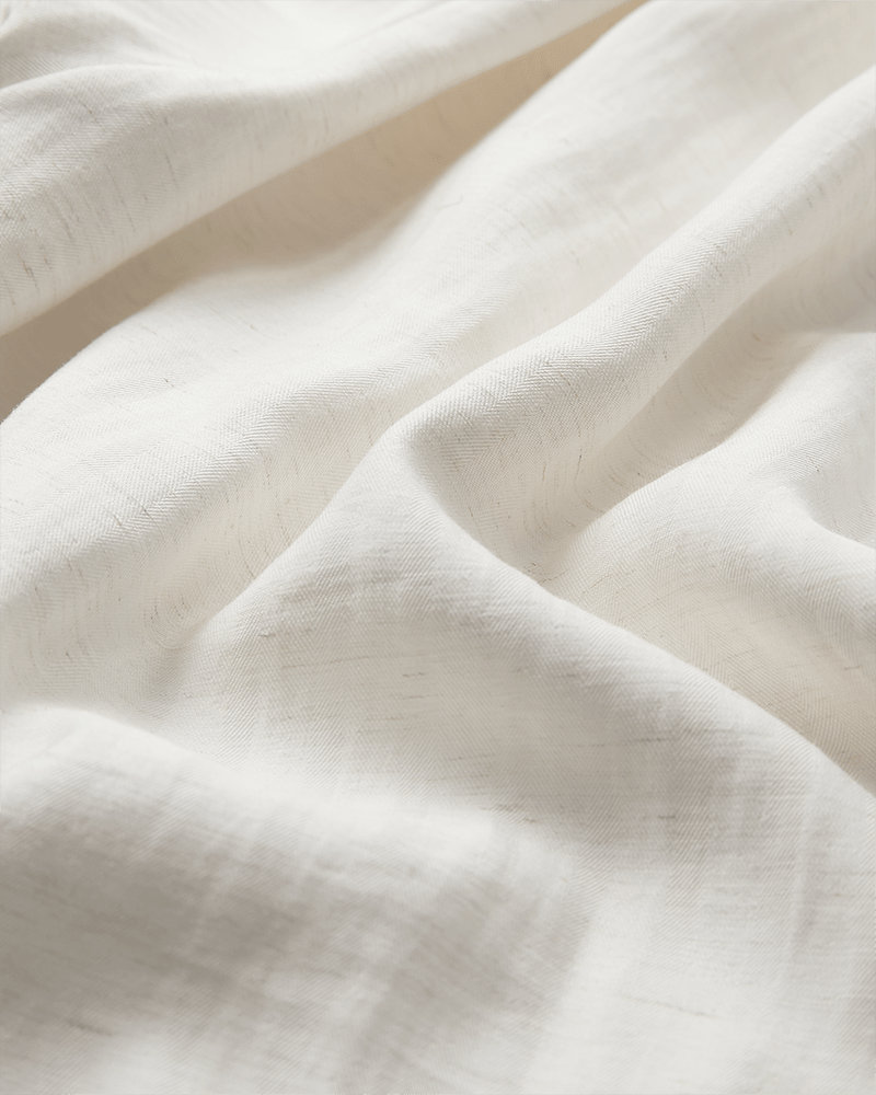 Nærbillede af et struktureret, off-white stof – perfekt til Copenhagen Muse 154864 Tenley Off-white bukser.