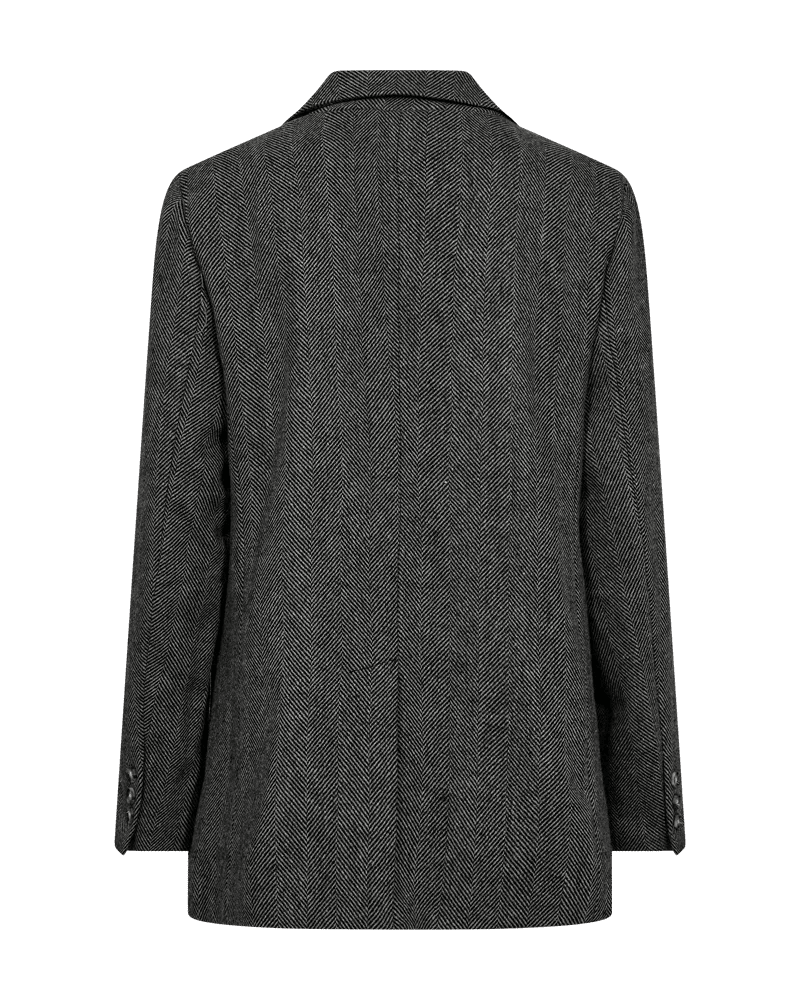 Bagfra set billede af Freequent Zango Sort-mønstret blazer med lange ærmer og udskåret krave på en ensfarvet baggrund.