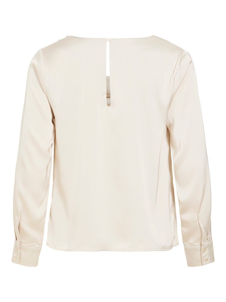 Bagfra set: VILA VIFreja – Offwhite langærmet bluse med en lille nøglehulsåbning øverst på ryggen.